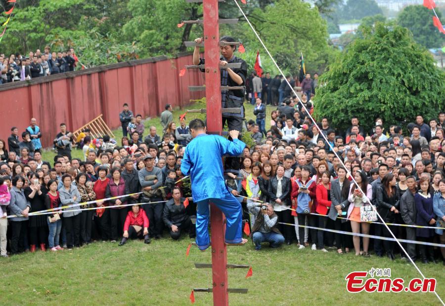 Climbing a ladder of knives to mark Double Third Day festival