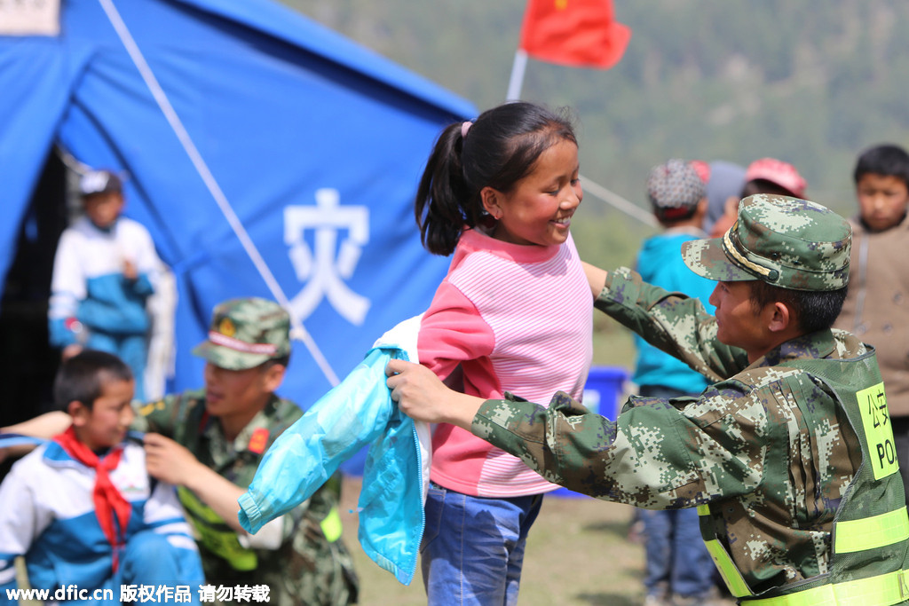 Earthquake relief soldiers have a lighter moment with kids