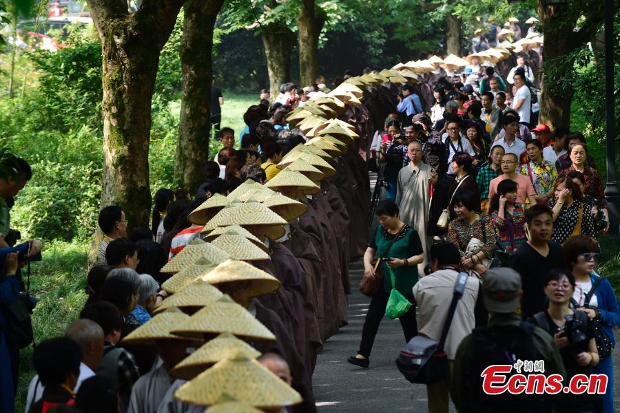 Monks walk for charity on birthday of Buddha