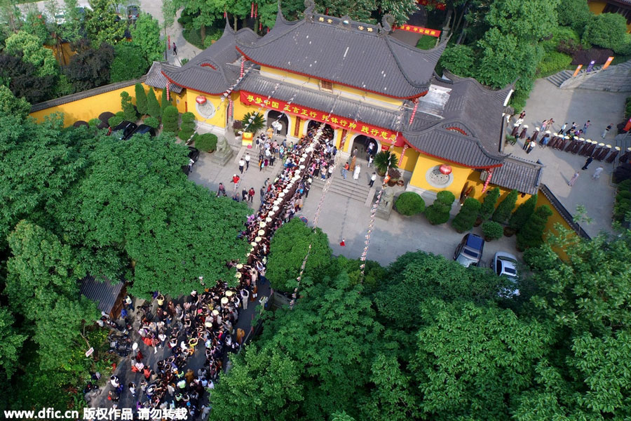 Monks walk for charity on birthday of Buddha