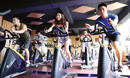 Newcomers plan to muscle in on China's gyms