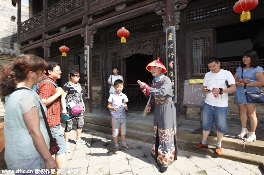 Creative tour guide dresses as ancient eunuch to welcome tourists