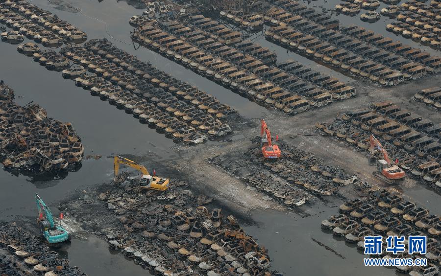Burnt vehicles cleaned up in core blast area in Tianjin