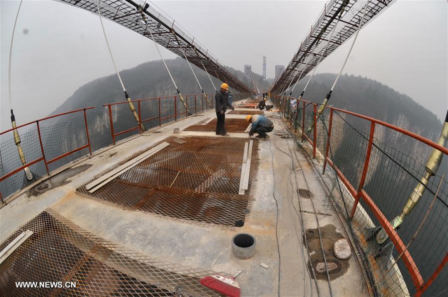Glass bridge across Zhangjiajie Grand Canyon under construction