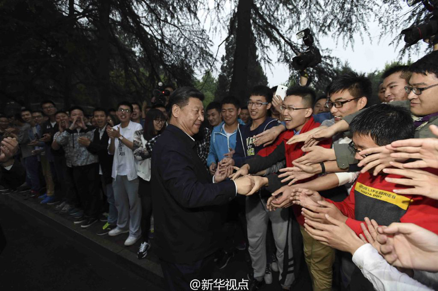Human-like robots say 'hi' to President Xi