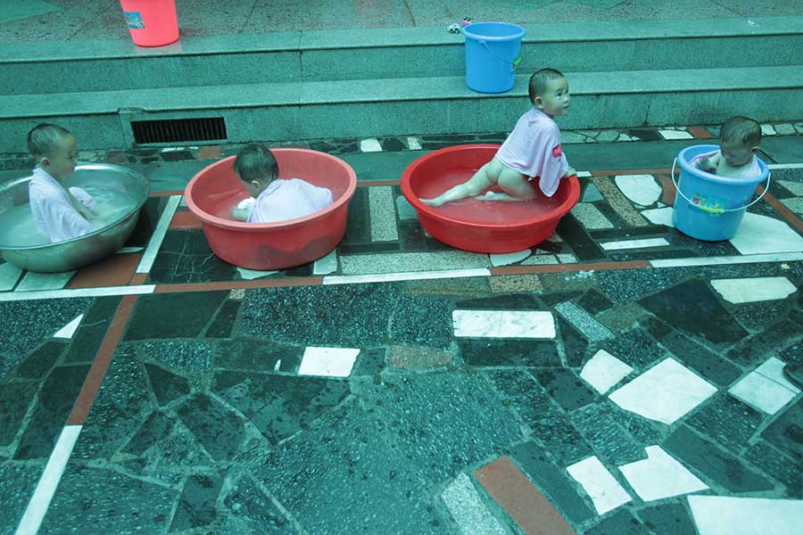 Four of a kind: Quadruplets get ready for school in Changsha