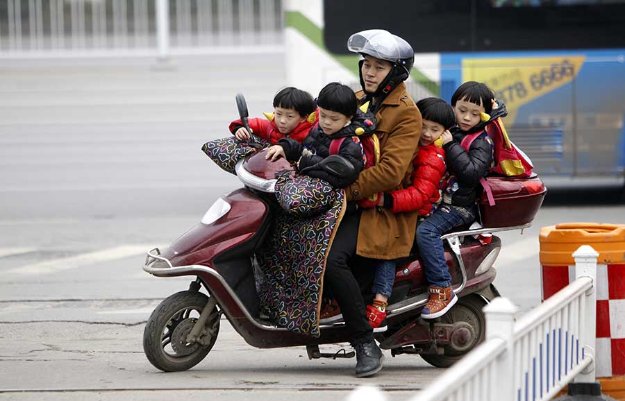 Four of a kind: Quadruplets get ready for school in Changsha