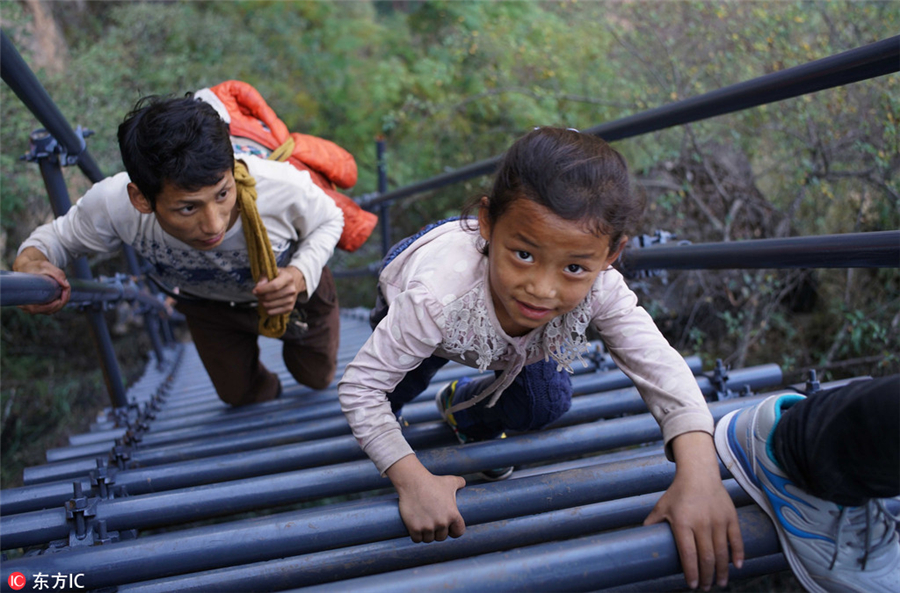 Steel ladder opens safer path for cliff village children