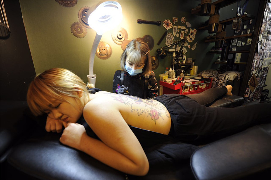 Young tattooist defies stereotype