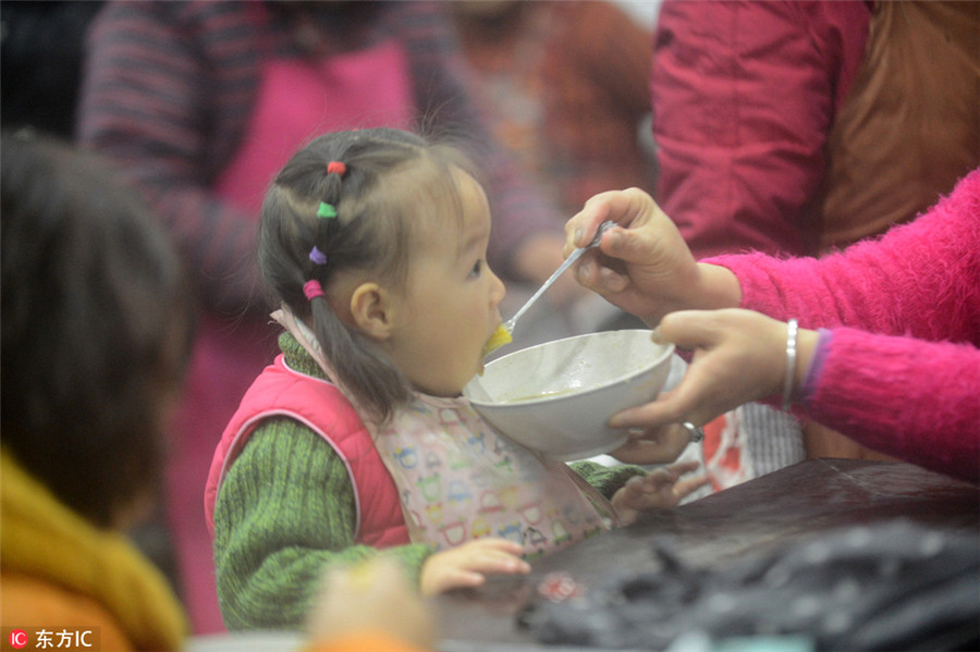 Chinese mark festival with 'eight treasure porridge'