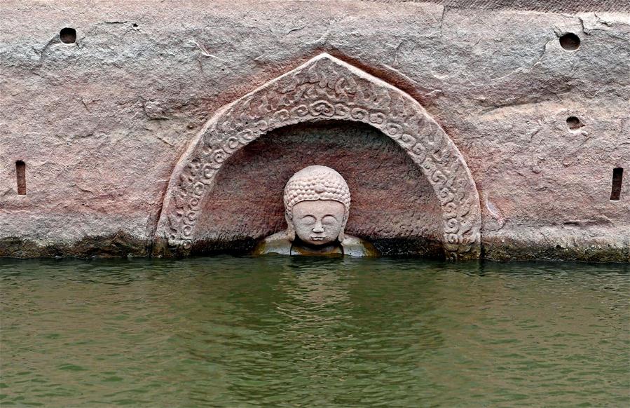Ancient Buddha found as water level of reservoir lowers in E China