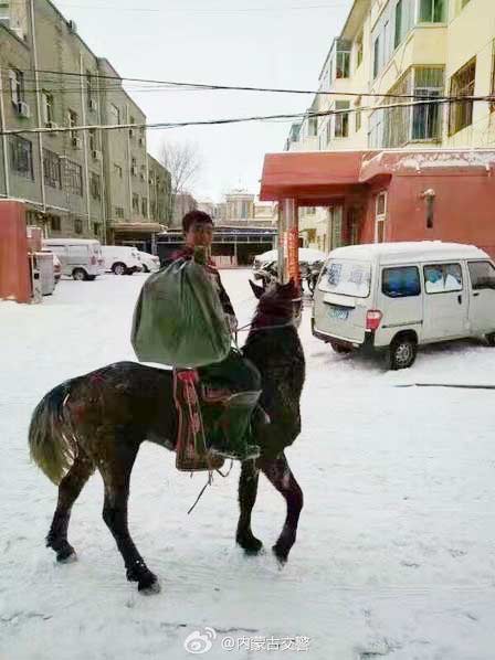 Mongolian courier delivers on horseback in snow