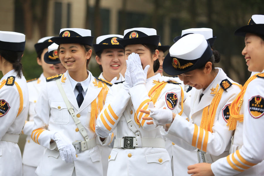 Female college students form flag-raising team