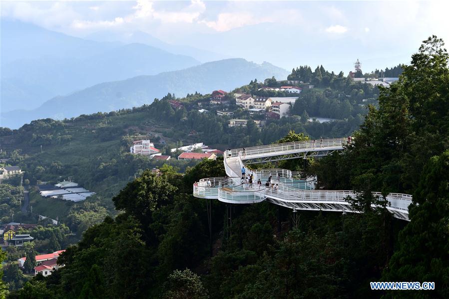 People enjoy scenery at high altitude sight-seeing footpath in Taiwan