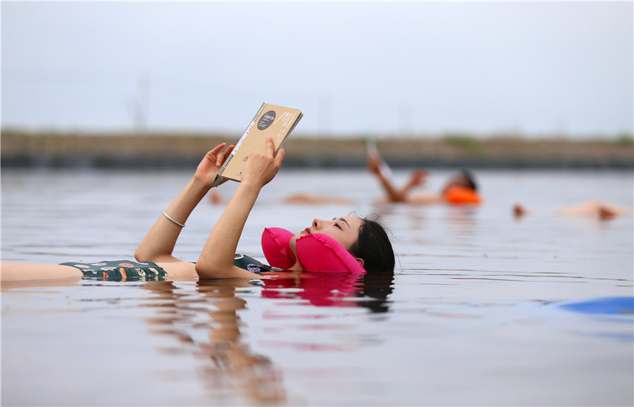 Swimmers float in 'Dead Sea' in Dalian