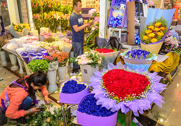 Flowers, mainly roses, serve as tokens of love