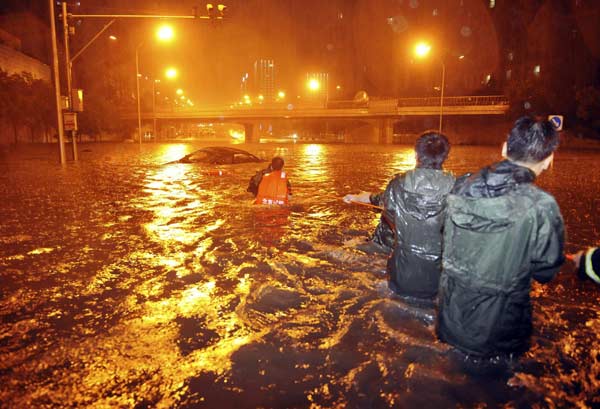 Death toll from Beijing downpours rises to 37