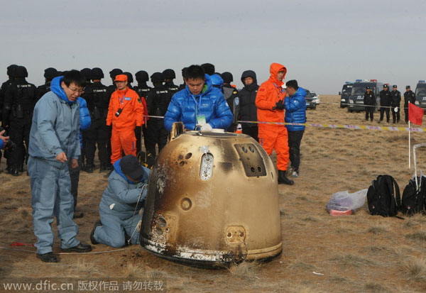 China's unmanned lunar orbiter returns home
