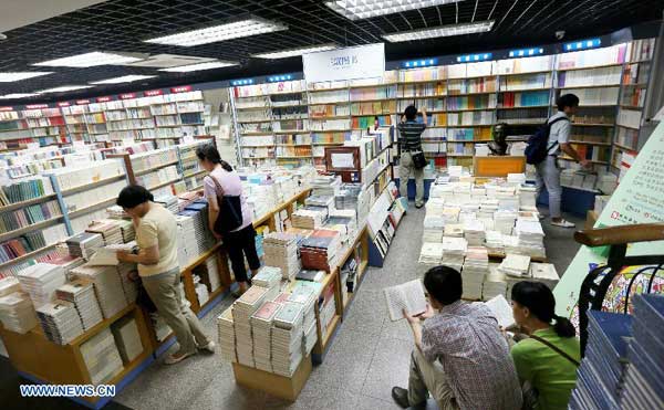 Residents read books at 24-hour bookstore in Beijing