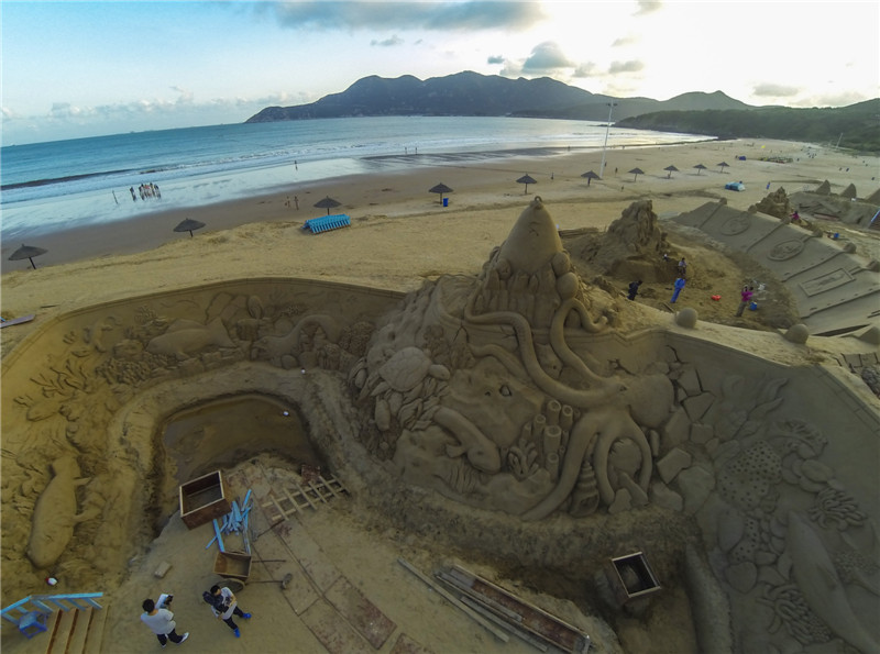 Sand sculptures take shape in East China