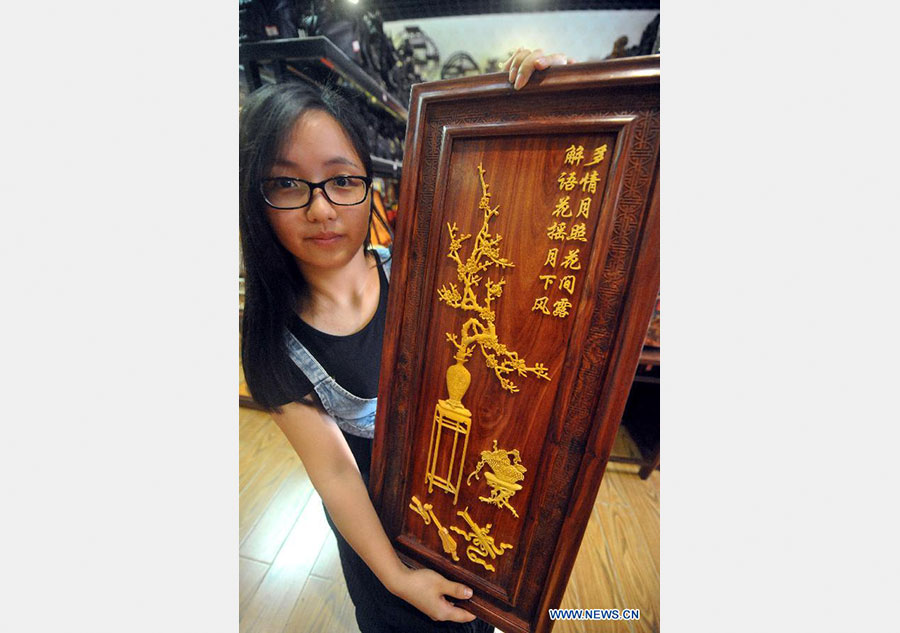 Wood art show held in Fujian