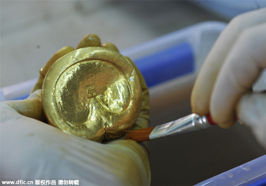 Goldware inscribed with characters unearthed from ancient cemetery