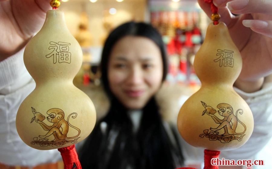 Monkeys on artist's gourd pyrography