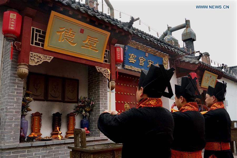 Ceremony taking porcelains out of kiln held in central China