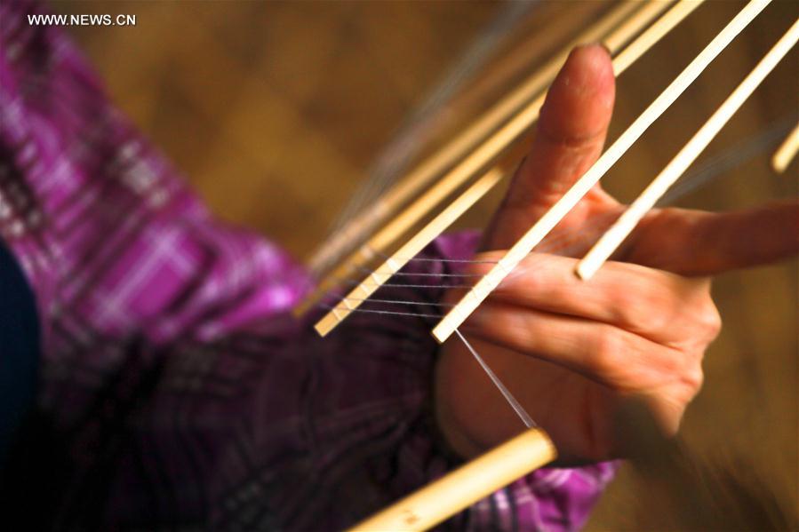 Traditional techniques of making Jialu oilpaper umbrellas in E China