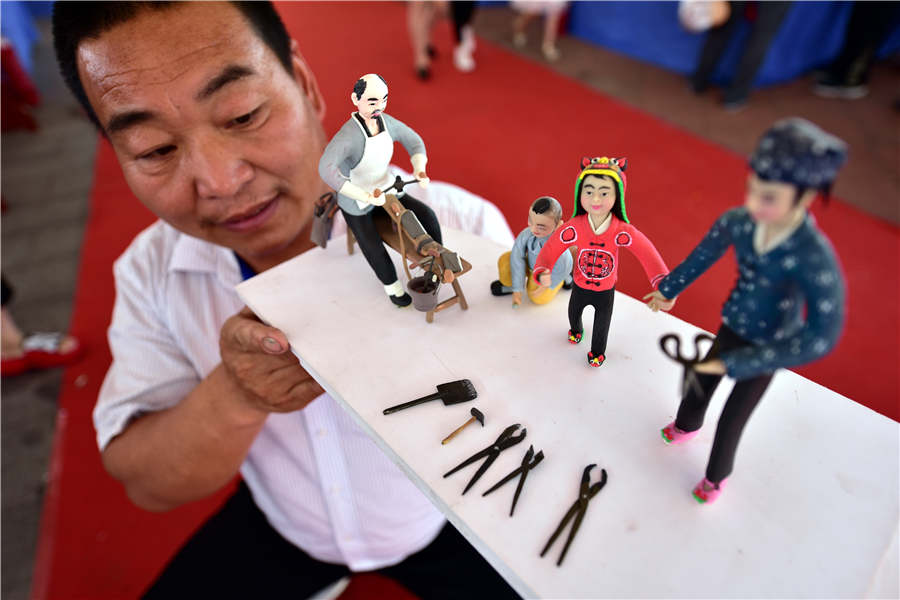 Dough figurines showcased at heritage expo in Shandong