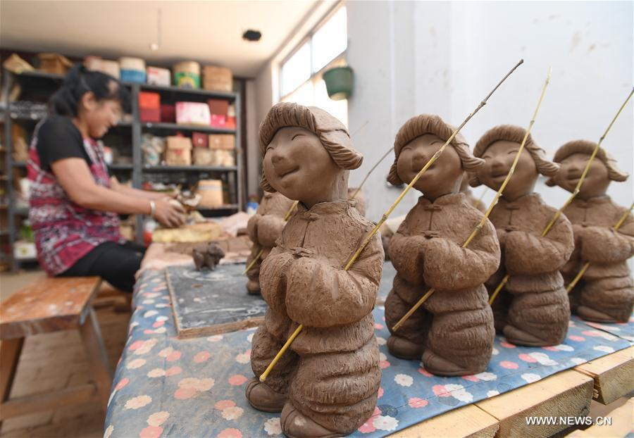 In pics: Sanchizhai clay sculpture in N. China