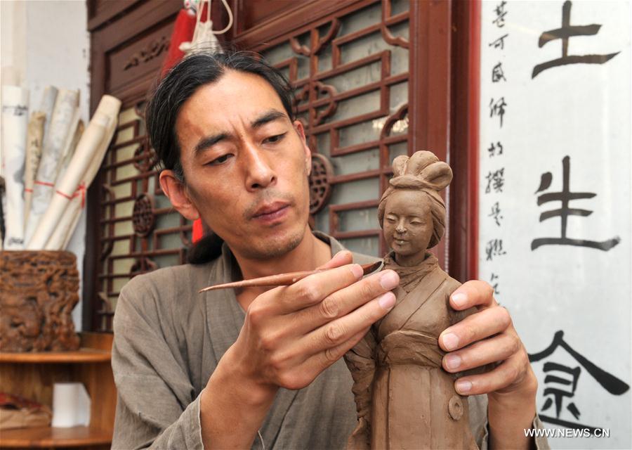 In pics: Sanchizhai clay sculpture in N. China