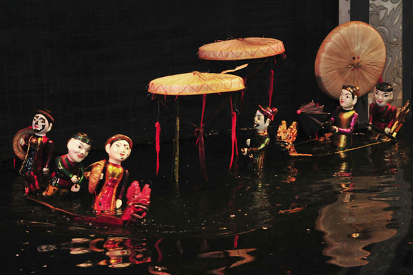 Tourists enjoy water puppet shows in Hanoi