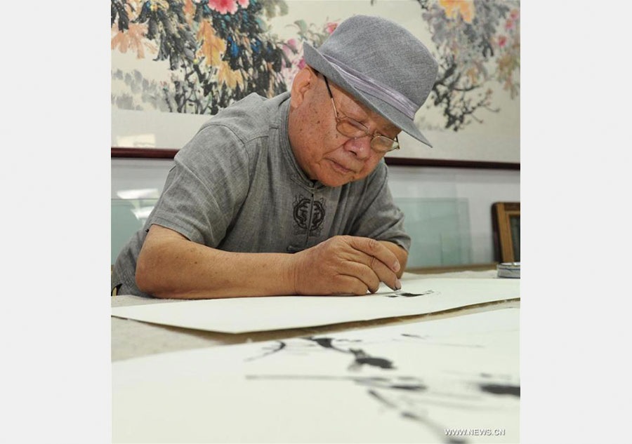 Artist demonstrates finger paintings
