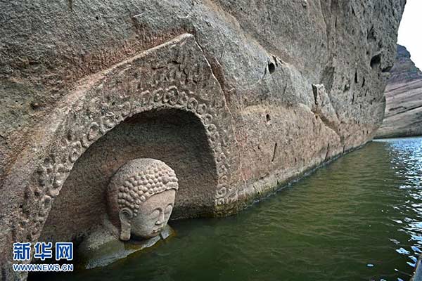 China to further excavate discovery site of re-emerging Buddha