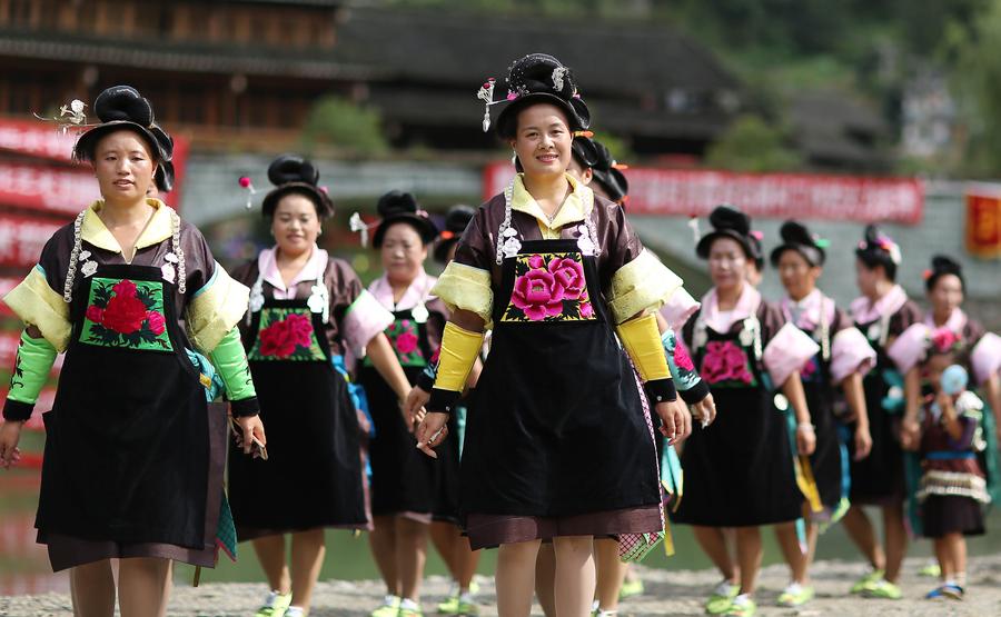 Miao people dance to celebrate 'Chixin Festival' in SW China's Guizhou