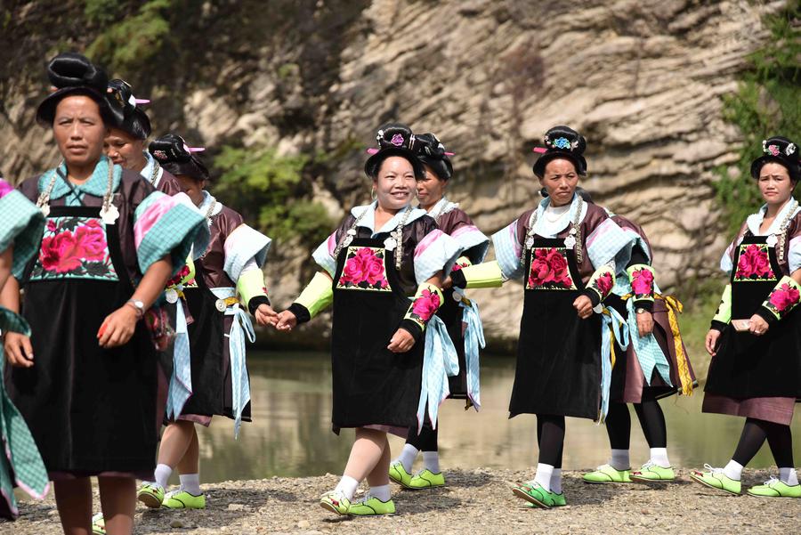 Miao people dance to celebrate 'Chixin Festival' in SW China's Guizhou