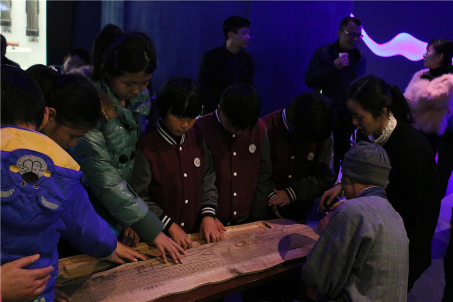 Visually-impaired students touch history with their senses