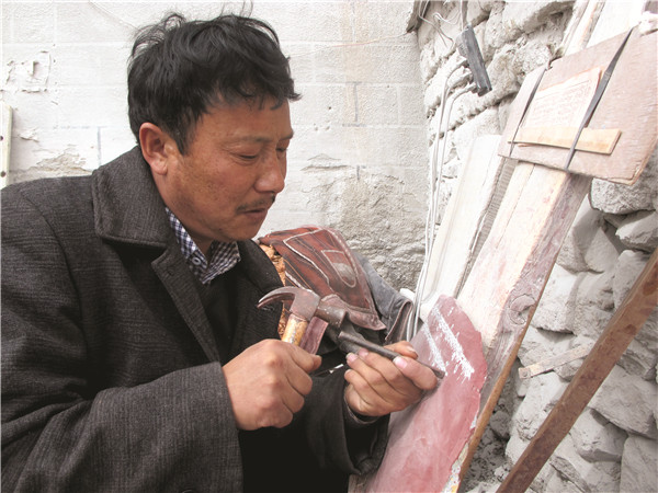 Craftsman continues ancient tradition of prayer-stone carvings