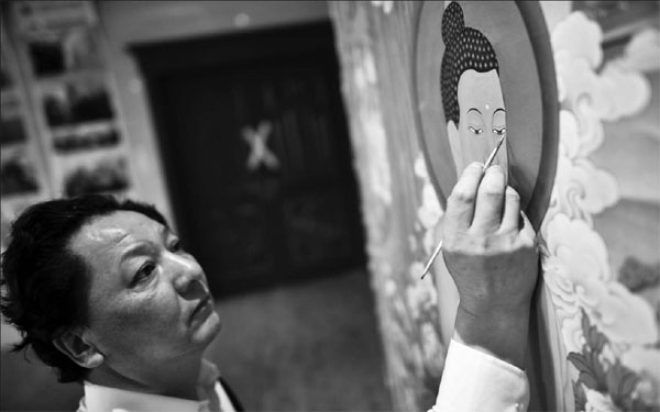 Scroll with it: the Life of a thangka star Painting Buddhas can become a lifelong obsession