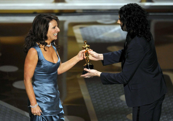 Director Susanne Bier (L) accepts the Oscar for best foreign film