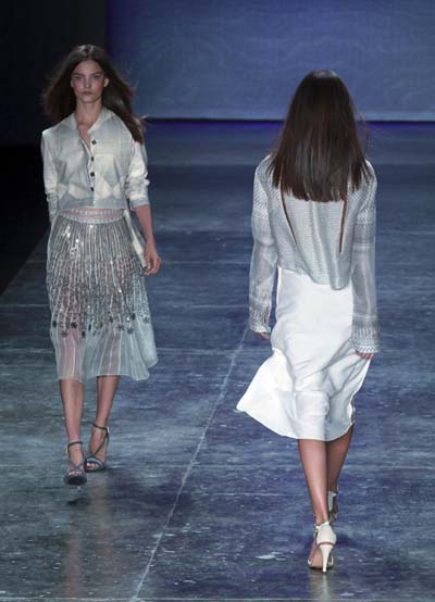 Models present creations during Sao Paulo Fashion week Summer 2012