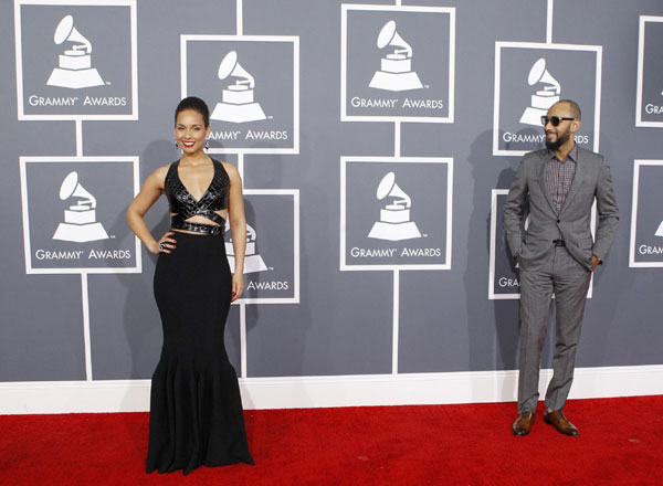 Stars show skin, but adhere to Grammy dress code