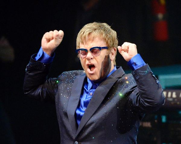 Elton John lauds young artists, then mixes his new songs with old