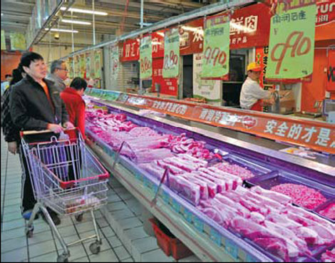 Pork prices fall, forcing down inflation rate