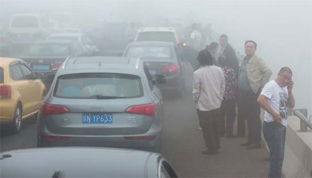 A smog-filled Beijing targets polluting cars to clean up air