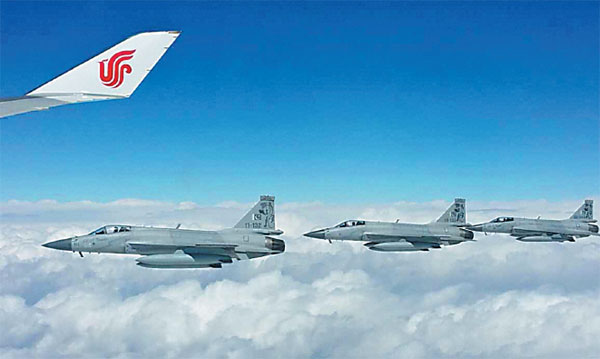 Chinese-made fighter jets escort Xi