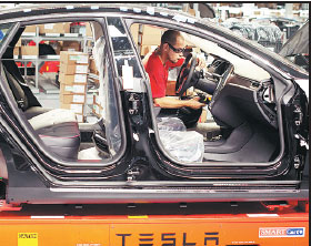 E-car firm Tesla powers ahead with new Model X