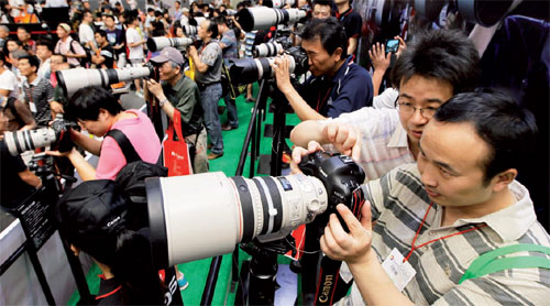 Canon boss boosts revenue with passion