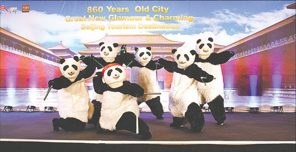 Pandas dance, spotlight Beijing